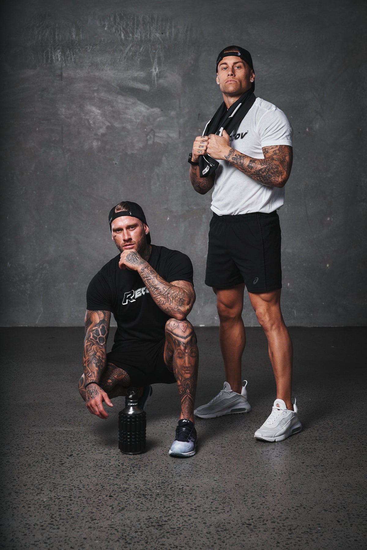 Two athletes in Recov training gear