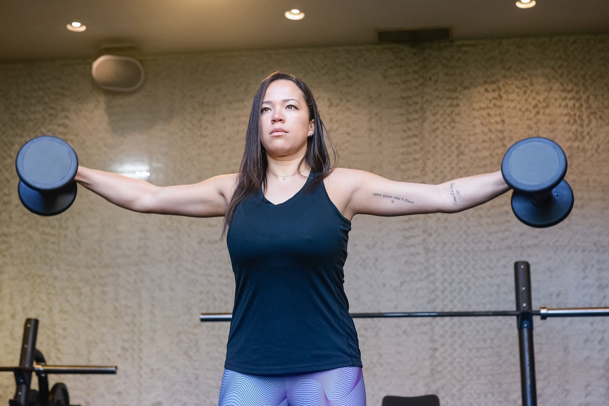 Woman training with weights
