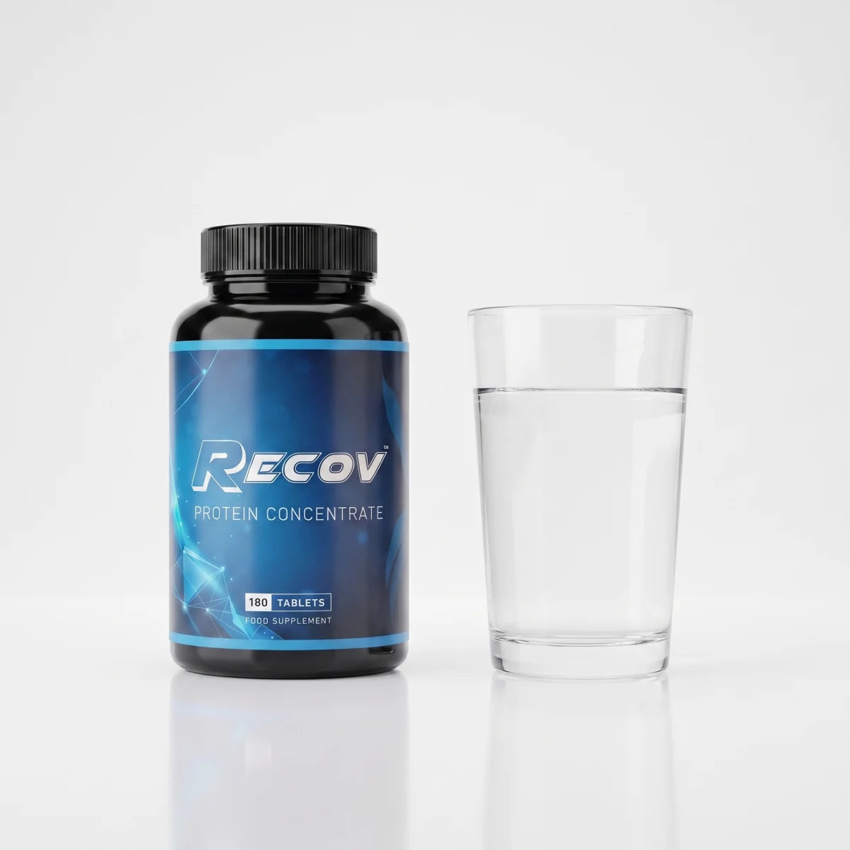 Recov bottle beside a glass of water