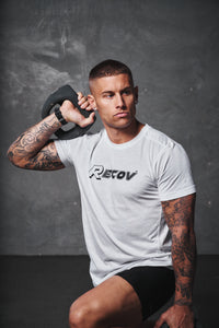 Recov Training Shirt in white, close-up of the Recov logo